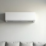 Plain white wall-mounted split-system air conditioner in a modern Australian living room