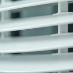Close-up of the angled louvre vanes on the air outlet of a wall mounted split system air conditioner